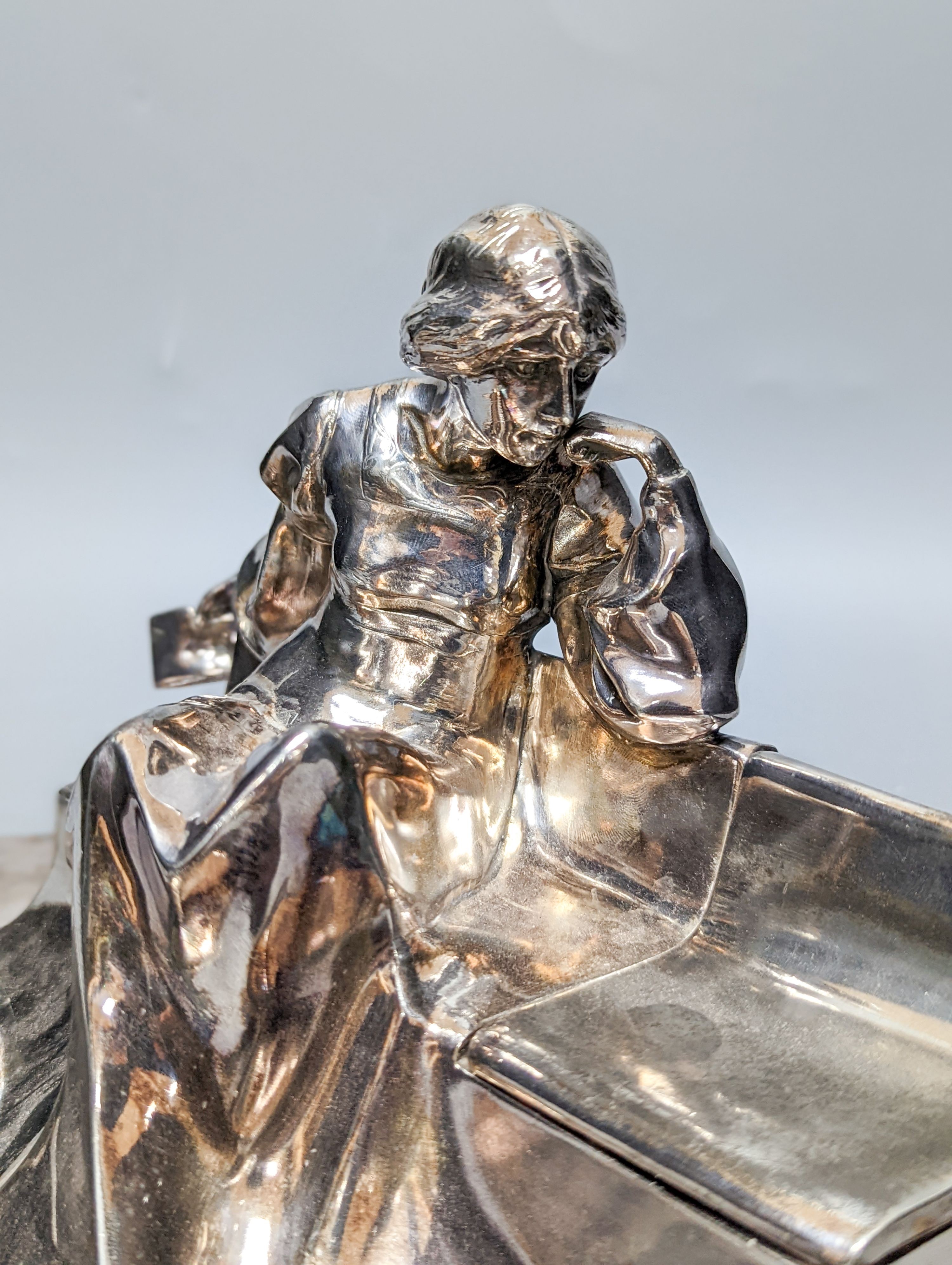 A WMF pewter teapot, an early 20th century bronze of Venus with dolphin, 2 other figures and a WMF style figural desk stand 36cm